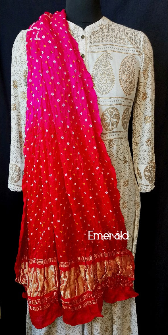 An ancient craft of 5000 years old, the term `Bandhani` is derived from the word `Bandhan' that means tying up, mainly used in the states of Gujarat and Rajasthan. This one is a shaded pink and red Bandhani on pure gajji silk with gold tissue patta at both ends. A total must-have for your festive/ wedding wardrobe.