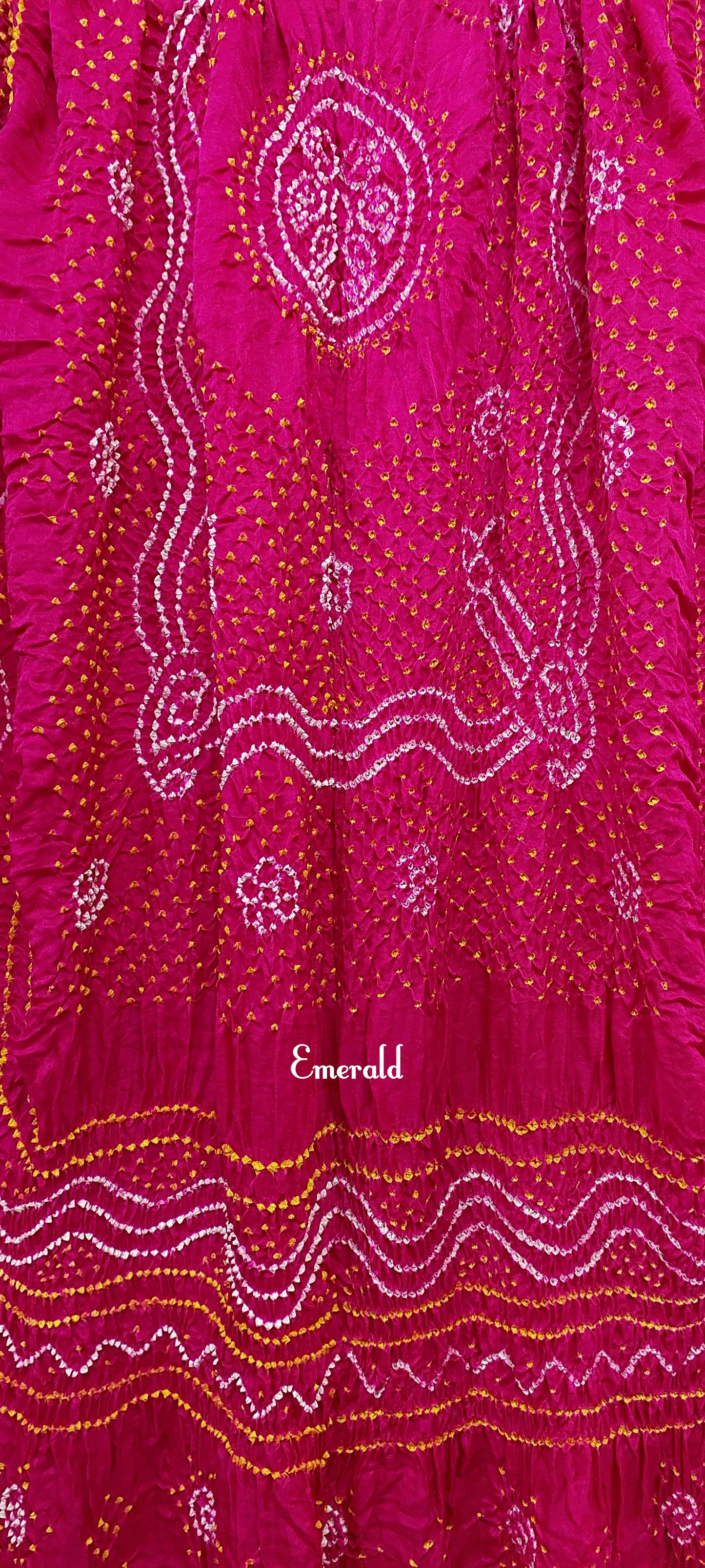 An ancient craft of 5000 years old, the term `Bandhani` is derived from the word `Bandhan' that means tying up, mainly used in the states of Gujarat and Rajasthan. This one is a pink Bandhani on pure gajji silk with gold tissue patta at both ends. A total must-have for your festive/ wedding wardrobe. 