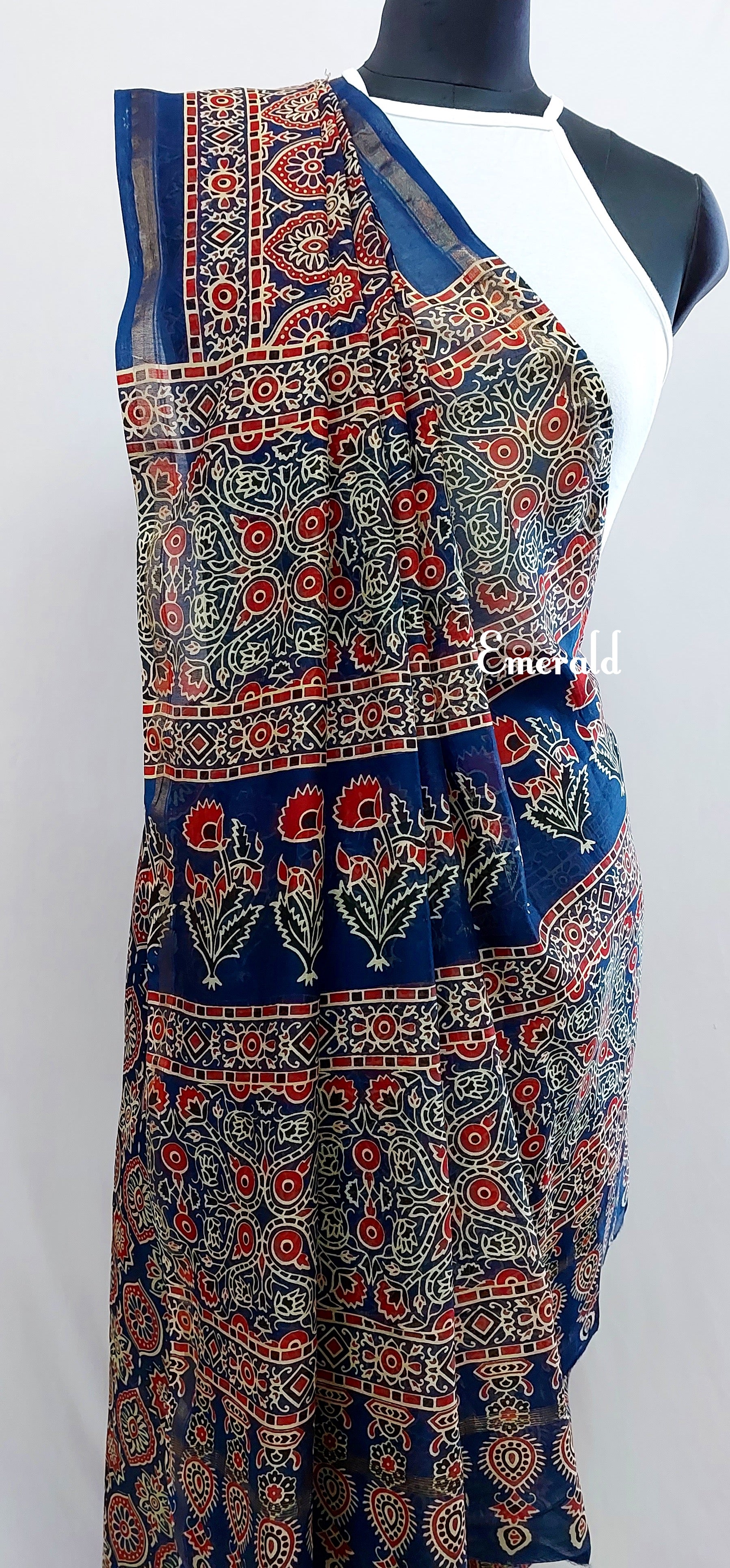 Traditionally, Ajrakh is the name of a block printed cloth with deep crimson red and indigo blue background, bearing symmetrical patterns with interspersed unprinted sparkling white motifs. Here we have a stunning blue screen printed Ajrakh on handwoven Chanderi. Mix and match with our ready to wear blouses for creating unique ensembles.