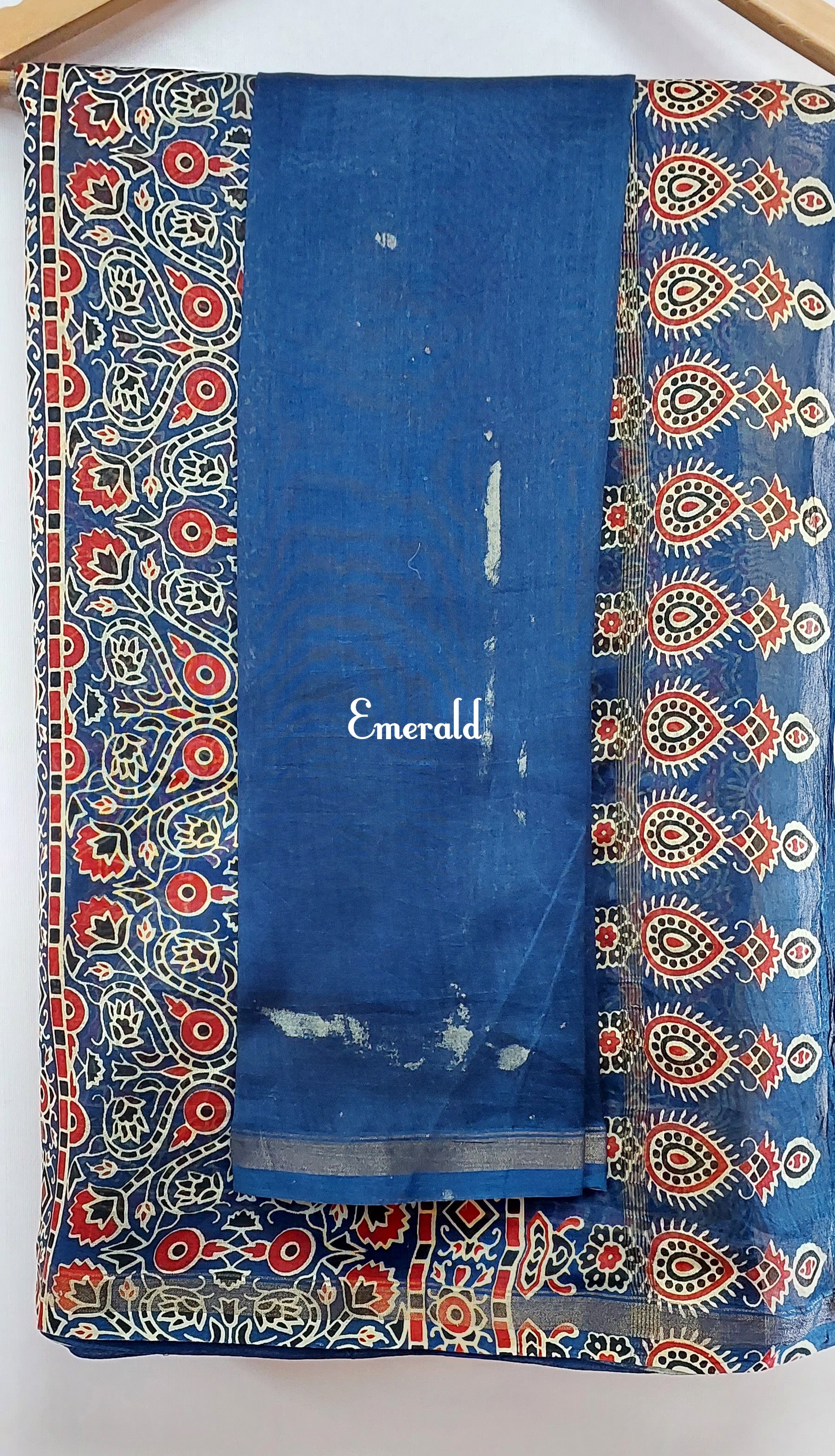 Traditionally, Ajrakh is the name of a block printed cloth with deep crimson red and indigo blue background, bearing symmetrical patterns with interspersed unprinted sparkling white motifs. Here we have a stunning blue screen printed Ajrakh on handwoven Chanderi. Mix and match with our ready to wear blouses for creating unique ensembles.