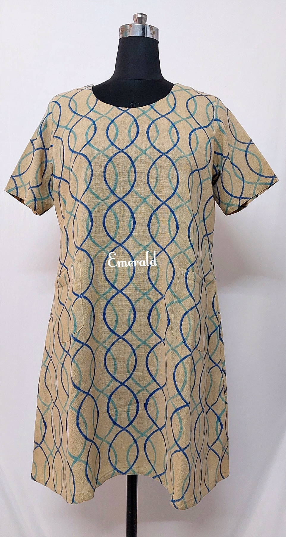 A handwoven, handprinted khaadi cotton dress for the summers! Fully lined and A- line. Two patch pockets in the front. There's enough margin on the sides to increase the size. Dress details: Length- 36in Shoulders- 15in Sleeve length- 9.5in Chest- 44in Waist- 44in Hips-54in Wash Care- Dry Clean Only.