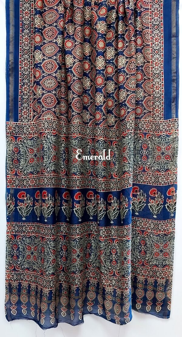 Traditionally, Ajrakh is the name of a block printed cloth with deep crimson red and indigo blue background, bearing symmetrical patterns with interspersed unprinted sparkling white motifs. Here we have a stunning blue screen printed Ajrakh on handwoven Chanderi. Mix and match with our  ready to wear blouses for  creating unique ensembles.