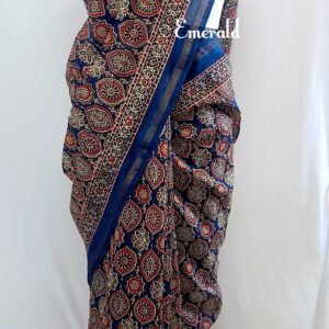 Traditionally, Ajrakh is the name of a block printed cloth with deep crimson red and indigo blue background, bearing symmetrical patterns with interspersed unprinted sparkling white motifs. Here we have a stunning blue screen printed Ajrakh on handwoven Chanderi. Mix and match with our ready to wear blouses for creating unique ensembles.