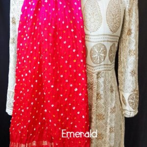 An ancient craft of 5000 years old, the term `Bandhani` is derived from the word `Bandhan' that means tying up, mainly used in the states of Gujarat and Rajasthan. This one is a shaded pink and red Bandhani on pure gajji silk with gold tissue patta at both ends. A total must-have for your festive/ wedding wardrobe.