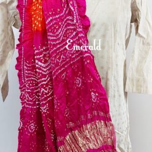 An ancient craft of 5000 years old, the term `Bandhani` is derived from the word `Bandhan' that means tying up, mainly used in the states of Gujarat and Rajasthan. This one is a shaded pink and orange Bandhani on pure gajji silk with gold tissue patta at both ends. A total must-have for your festive/ wedding wardrobe.